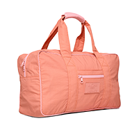 peach duffel bag with top handles isolated on white background