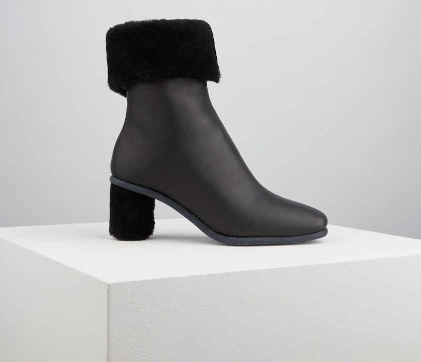 product shot of black ankle boots refined through shoe image editing with edge precision and dust cleanup for catalogs