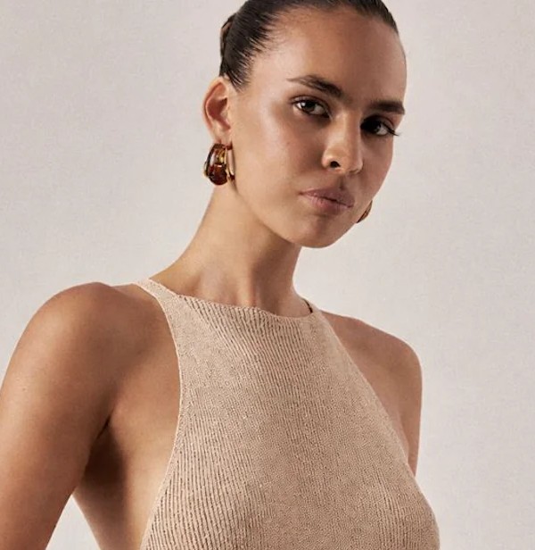 Model in a textured beige top with accurate color correction and consistent product appearance