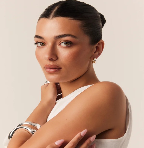Natural skin retouching for model-based e-commerce catalog images, preserving realistic texture and detail