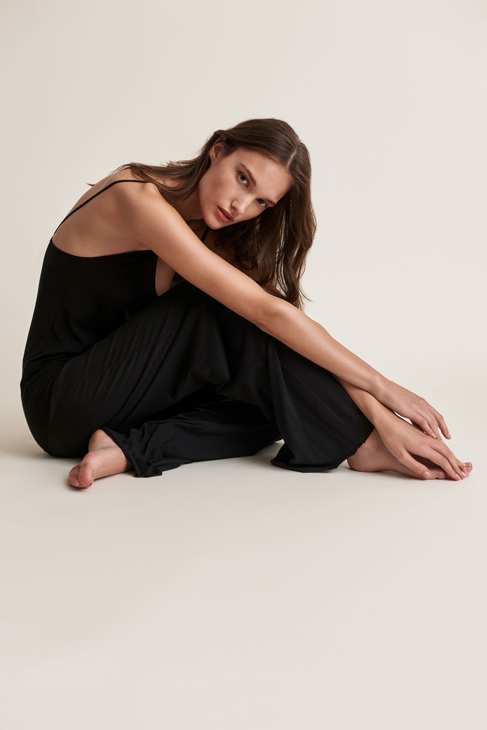 Fashion image retouching with refined color and tonal balance for a black outfit