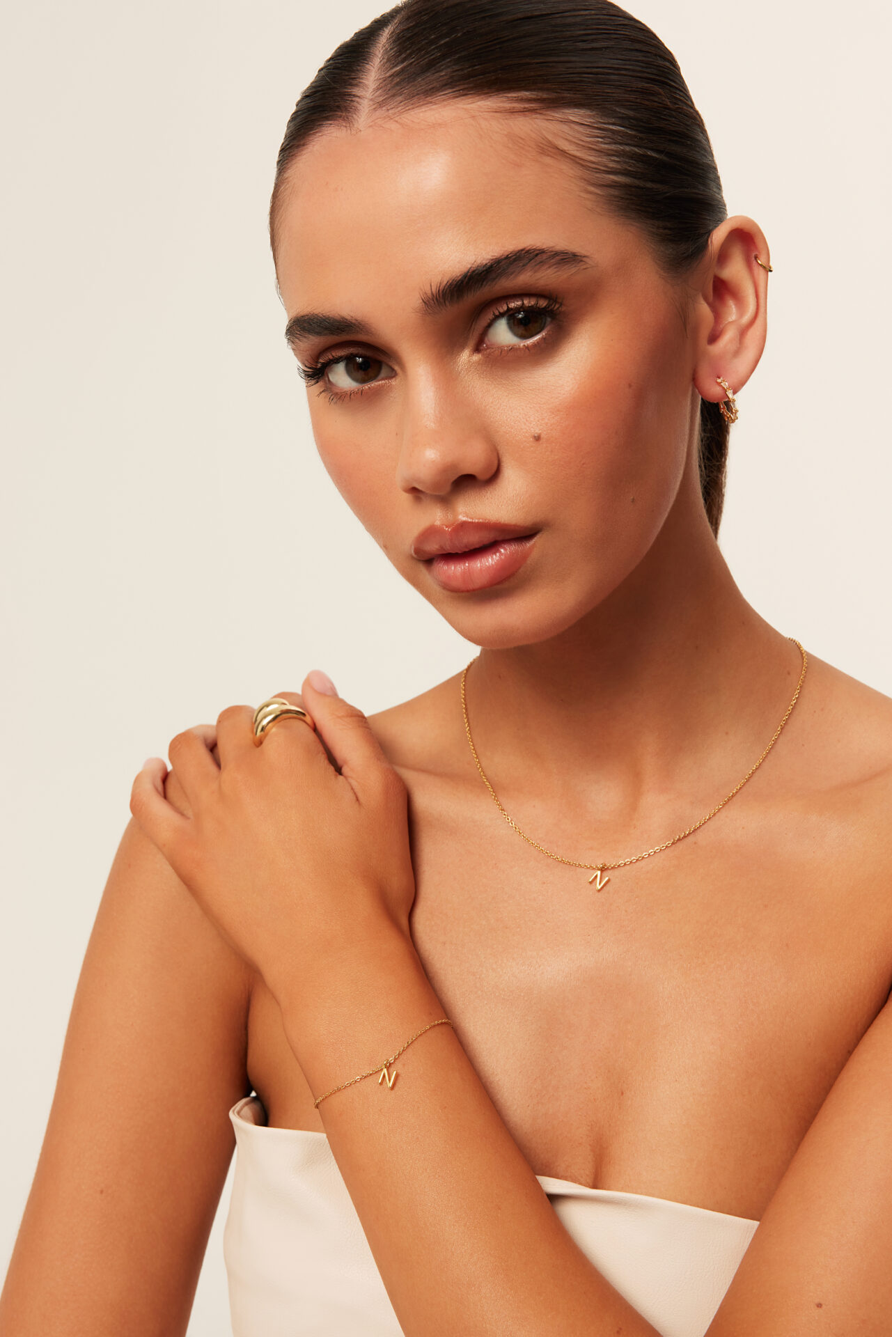 Fashion lookbook portrait retouching with natural skin, hair, and facial detail refinement