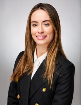 Business headshot of a woman in a black blazer with refined skin tones and polished facial details